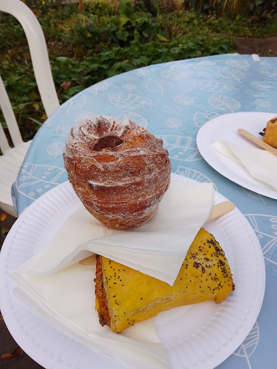 A sugar-dusted cruffin and a slice of cake