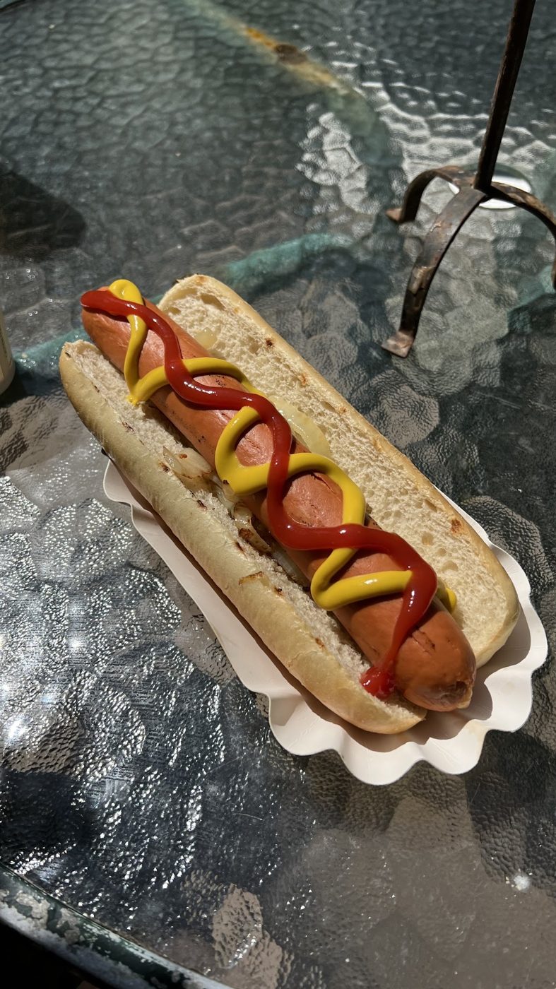 A hot dog with ketchup and mustard